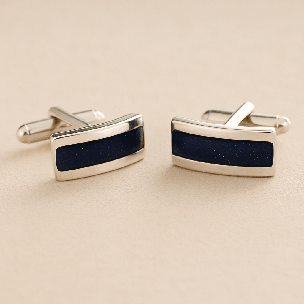 Silver Curved cremation cufflinks with navy colour resin inlay with cremation ashes or fur on a beige background