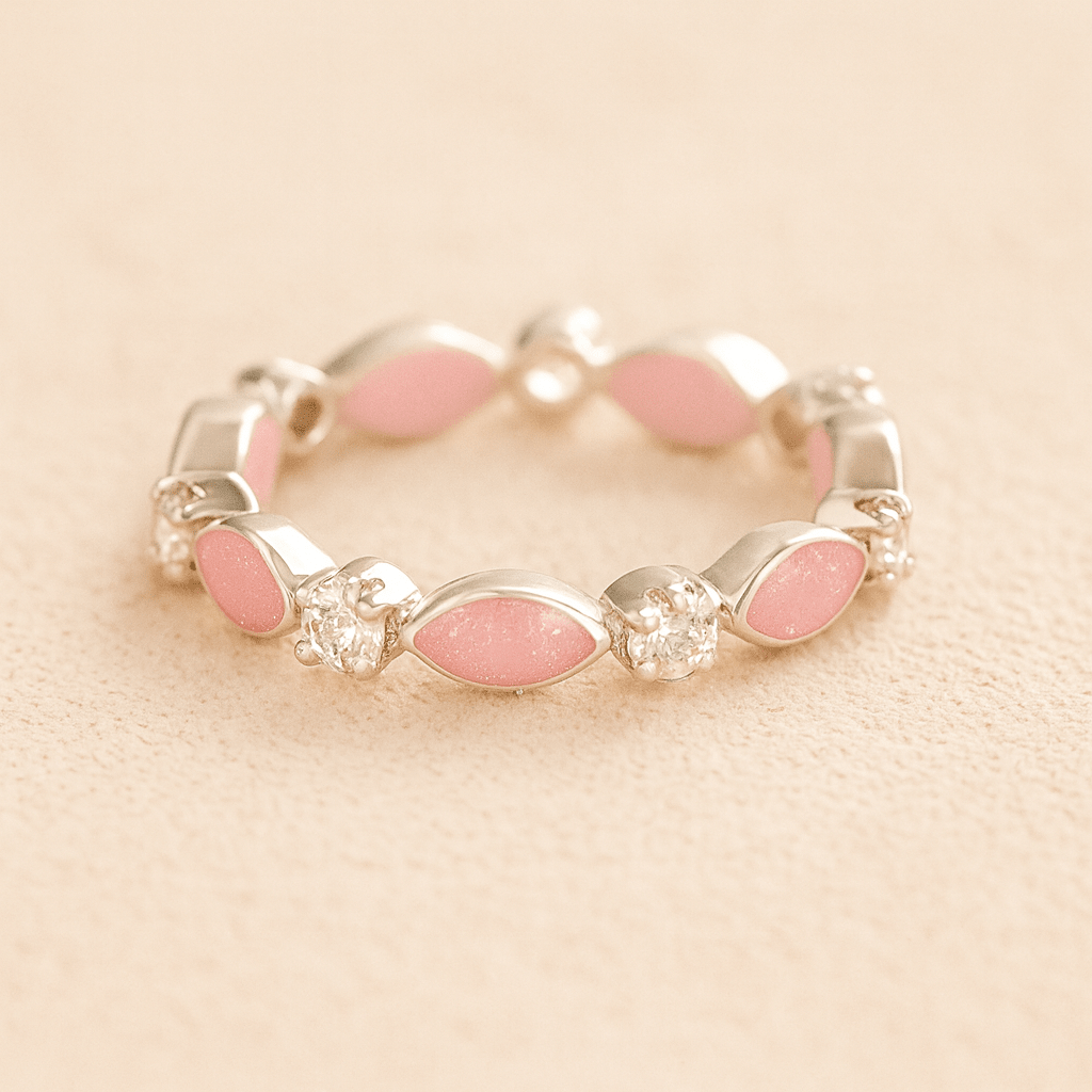 Silver cremation ashes ring with light pink resin and crystal accents, filled with ashes or fur, displayed on a soft beige background – suitable for pet or human memorials.