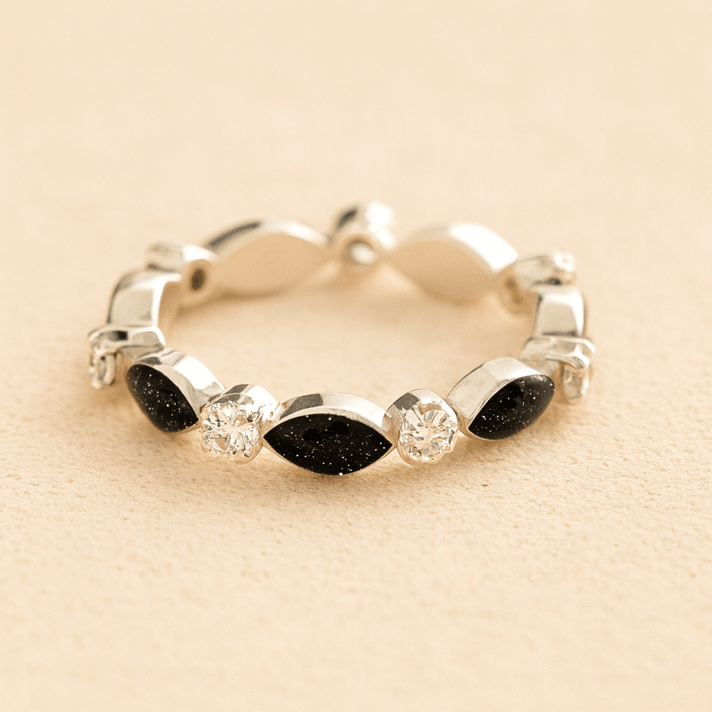 Silver cremation ashes ring with Black resin and crystal accents, filled with ashes or fur, displayed on a soft beige background – suitable for pet or human memorials.