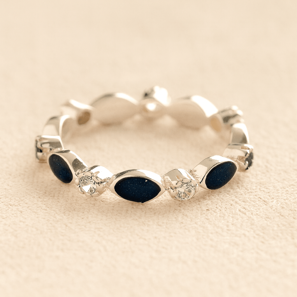 Silver cremation ashes ring with Navy resin and crystal accents, filled with ashes or fur, displayed on a soft beige background – suitable for pet or human memorials.