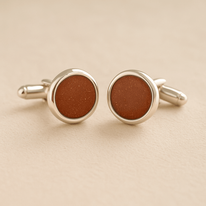 Silver Memorial Ashes Cufflinks with rust resin with ashes or fur on a beige background
