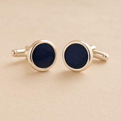 Silver Round Ashes Cufflinks with navy resin with ashes or fur on a beige background