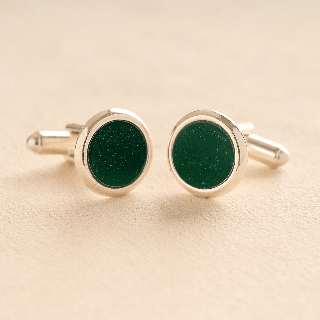 Silver Round Ashes Cufflinks with dark green resin with ashes or fur on a beige background