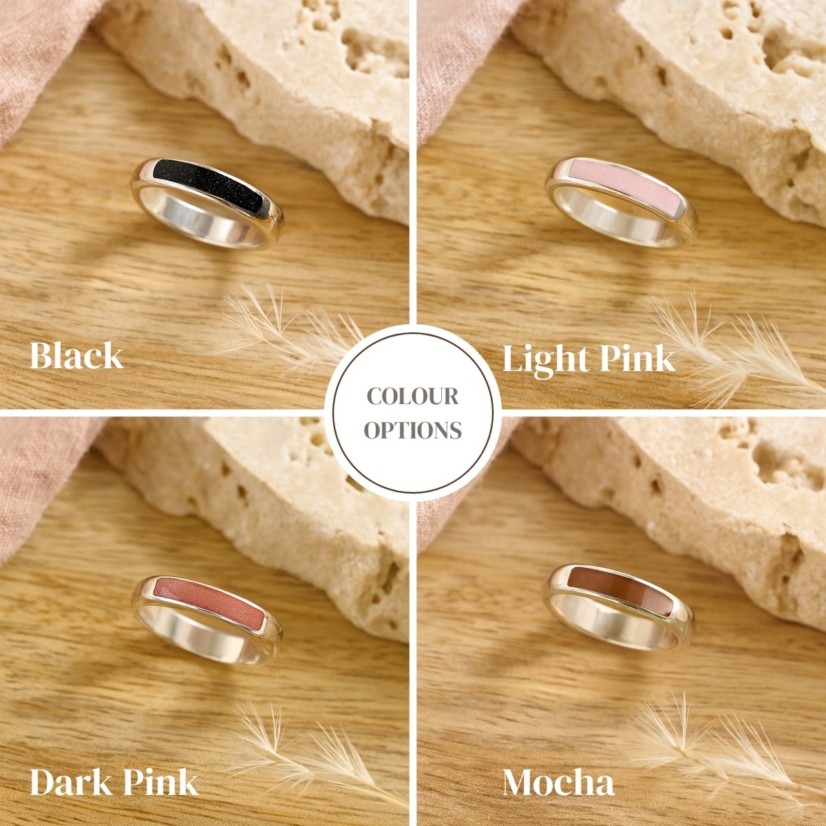 Four memorial ring color options displayed on a wooden surface with labels.