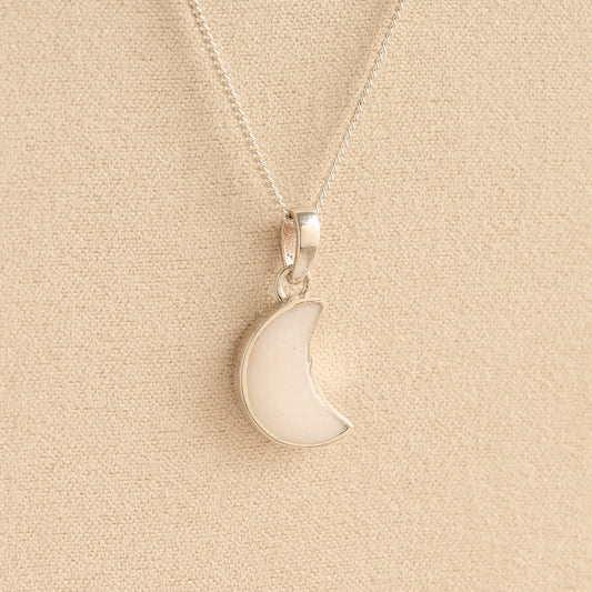 Silver Moon memorial Necklace with white resin, filled with ashes or fur, displayed on a soft beige background – suitable for pet or human memorials.