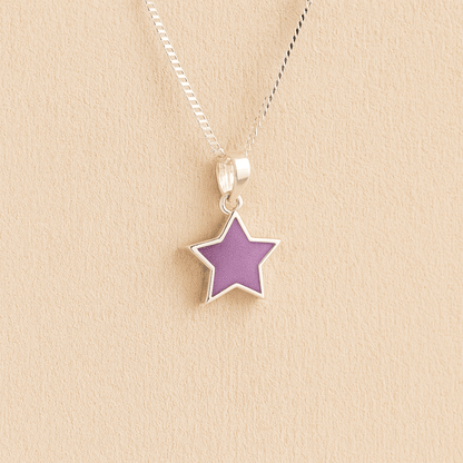 Silver star ashes pendant with lavender resin on a beige background