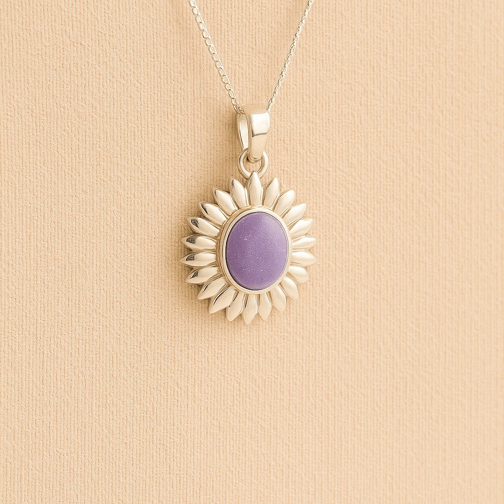 Sterling Silver Sunflower Ashes Necklace with a lavender resin infill containing ashes or fur set on a beige textured background