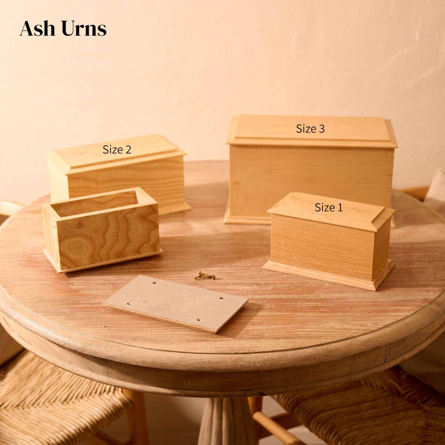 Various sizes of custom engraved ash wood cremation urns – personalised solid wood memorials