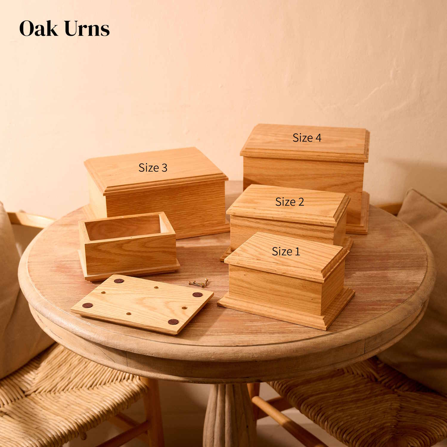 Various sizes of custom engraved oak wood cremation urns – personalised solid wood memorials