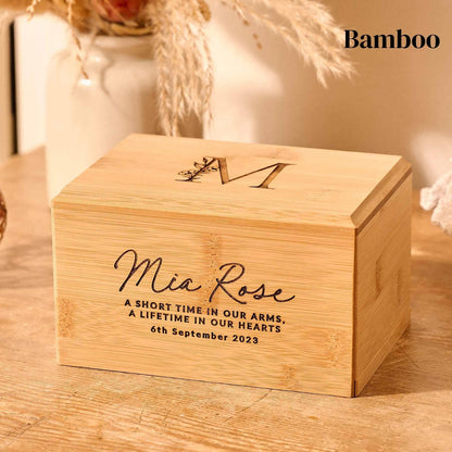 A cremation urn made of bamboo for a stillborn infant. Engraved urn.